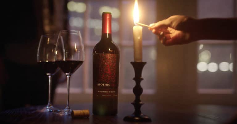 Candle and wine bottle