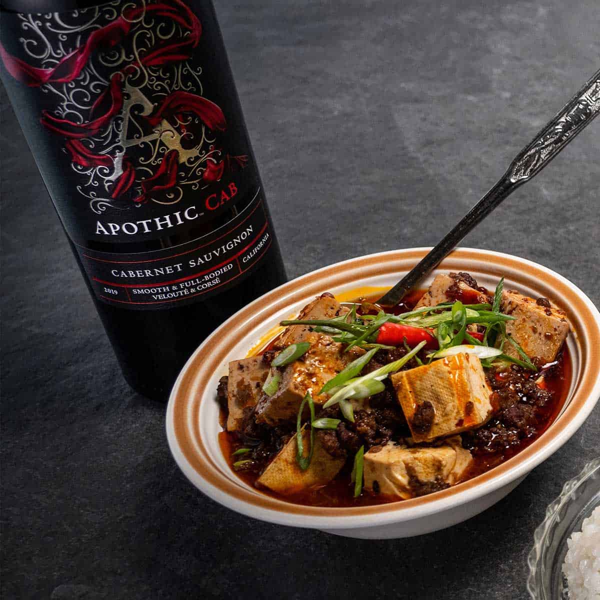 Bowl of Mapo tofu with Apothic Cab bottle